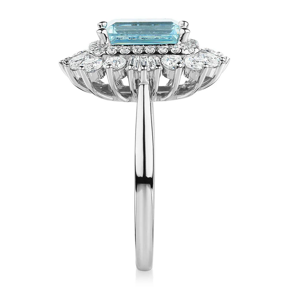 Dress ring with 9x7mm aquamarine simulant and 1.43 carats* of diamond simulants in 10 carat white gold