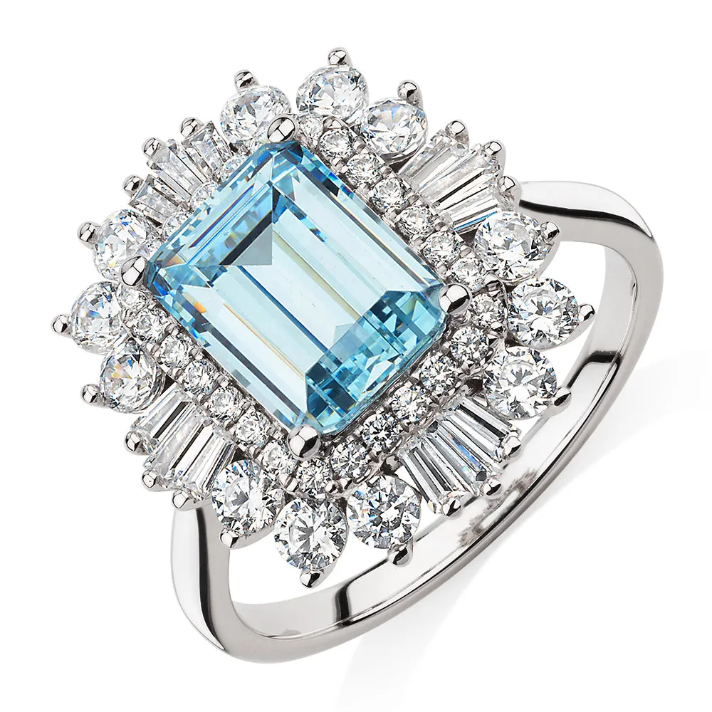 Dress ring with 9x7mm aquamarine simulant and 1.43 carats* of diamond simulants in 10 carat white gold